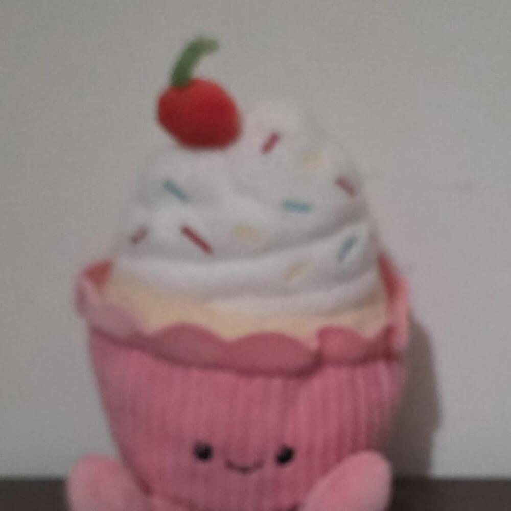 giggle scape Pink cupcake plushie with white frosting, colorful sprinkles, and a